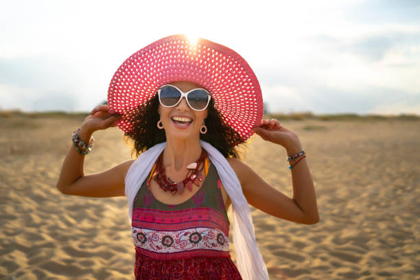 istock Happy woman enjoying summer vacations 1019785664
