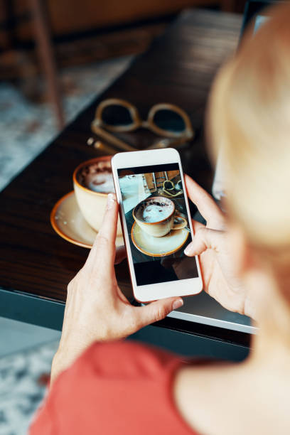 istock Woman photographing food 1019786008