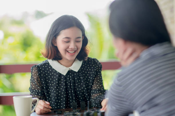 istock asian girls playing domino game 1019794776