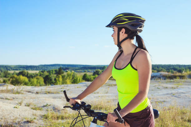 istock Woman on a bicycle against the blue sky 1019802048