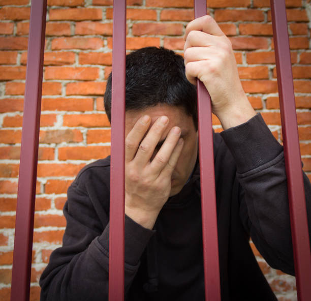 istock The prisoner behind the bars 1019802664