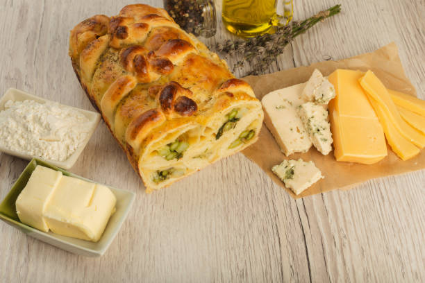 istock Pie with asparagus and cheese on a wooden background with ingredients 1019805128