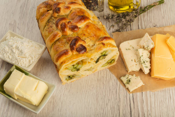 istock Pie with asparagus and cheese on a wooden background with ingredients 1019805164