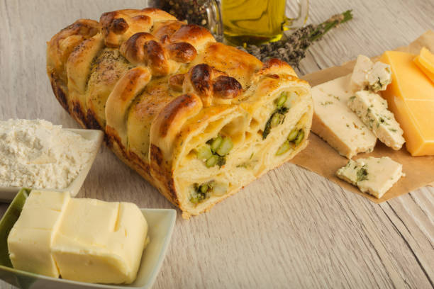 istock Pie with asparagus and cheese on a wooden background with ingredients 1019805178
