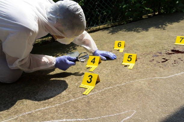 istock Forensic expert collects evidence at the crime scene 1019805200