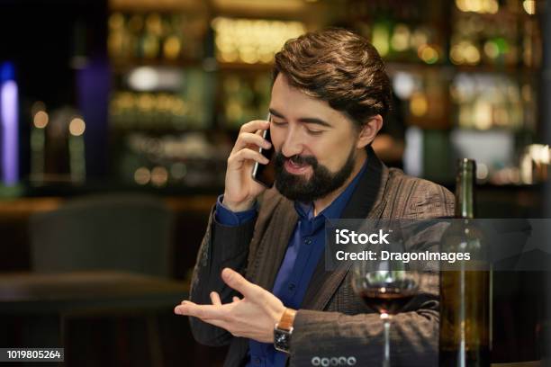 Man Talking On Phone Stock Photo - Download Image Now - Adult, Alcohol - Drink, Authority