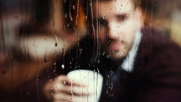 istock Thoughtful man looking out the window 1019827282
