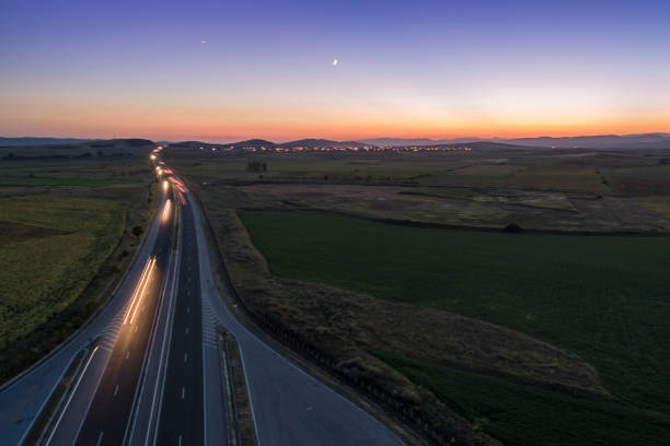 istock Traffic blurred motion at sunset on Trakia highway aerial view 1019832454
