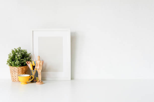 istock Workspace Stylish with poster and coffee cup. Workplace desk and copy space. 1019838880