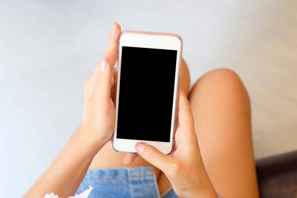 istock Woman using mock up smartphone mobile with top view. 1019838990