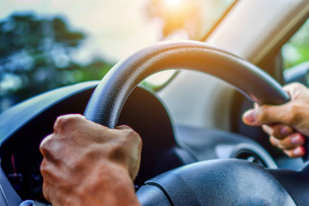 istock Man driving car on road transportation highway road 1019839308