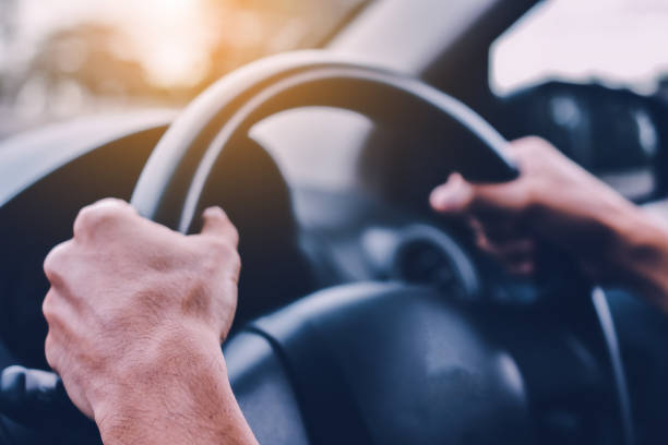 istock Man driving car on road transportation highway road 1019839472