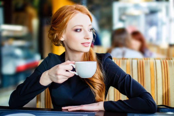 istock Pretty young girl in cafe. 1019849824