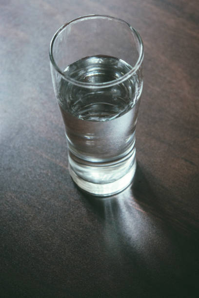 istock Water glass on wooden table 1019856994