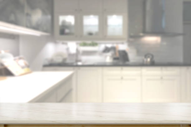 istock Marble countertops with modern kitchen room background. 1019857914