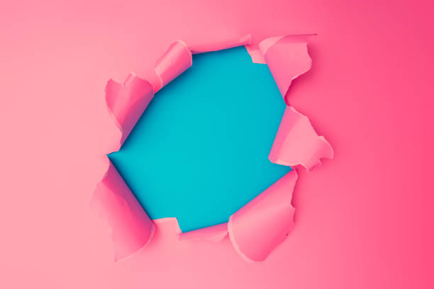 istock Vivid pink torn paper. Burst hole background. 1019858398