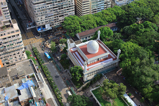 Chinese-style building and mosque tower in Kowloon, Hong Kong
