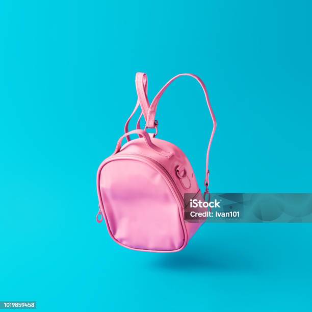 Pastel Pink School Bag Floating On Sky Blue Background Stock Photo - Download Image Now