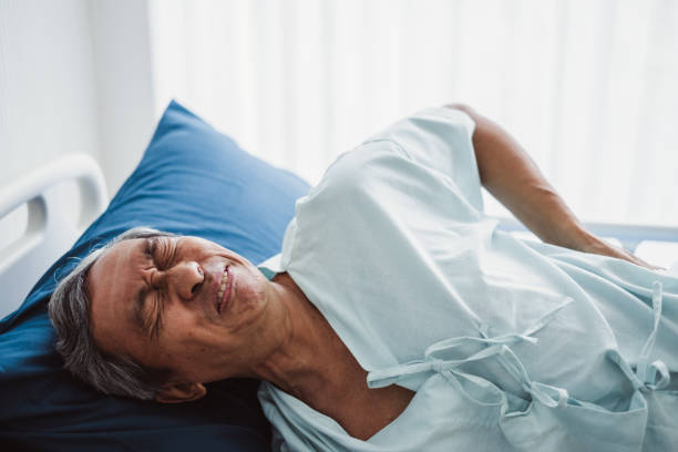 Old senior asian patient suffering from back pain, back ache