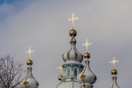 Domes with crosses of the Orthodox Cathedral. Smolny Cathedral in St. Petersburg