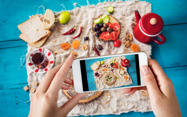 istock Woman taking a photo of breakfast table 1019862768