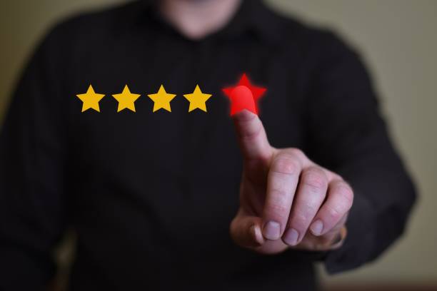 istock Businessman click on five red stars to increase rating. 1019866260