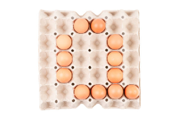 istock Raw brown Chicken Eggs In paper container tray box arranged English alphabet is 