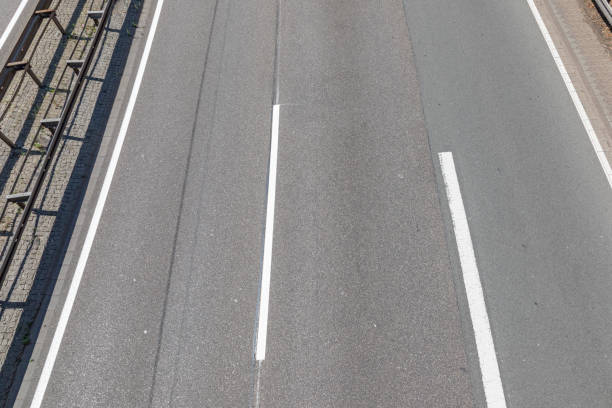 istock aerial of empty highway with road markings 1019875982
