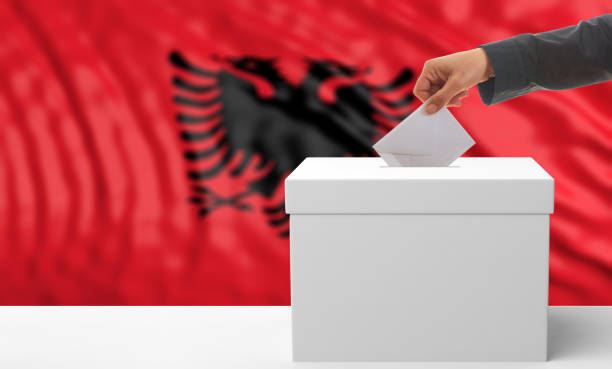 istock Voter on an Albanian flag background. 3d illustration 1019876362