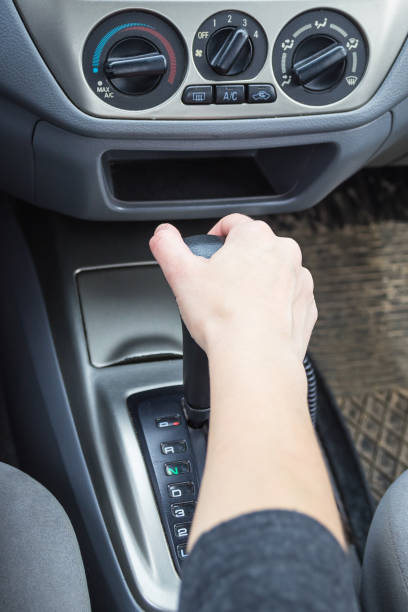 istock Female hand on the shift lever automatic transmission. 1019886642