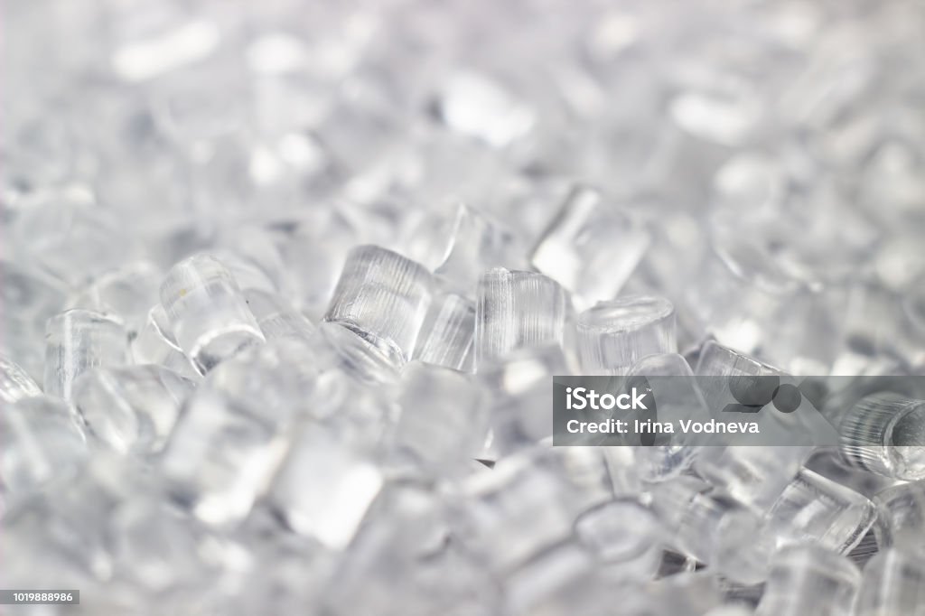 Transparent Plastic granules. Polymer pellets. Isolated on a black background. Transparent Plastic in granules. Polymer pellets. Isolated on a black background. Plastic Stock Photo