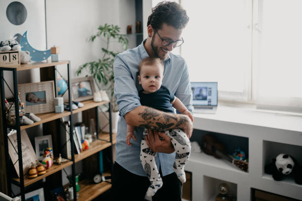 istock Dad holding his baby boy 1019889192