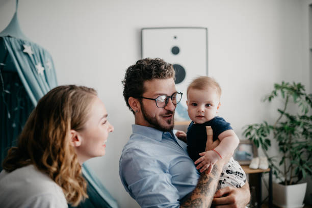 istock Dad holding his baby boy 1019889196