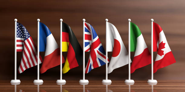 istock G7-G8 flags on wooden background. 3d illustration 1019889694