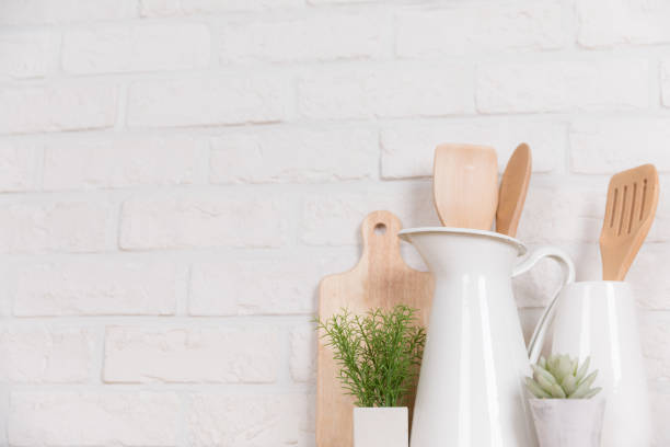 istock Kitchen utensils and dishware on wooden shelf. Kitchen interior background.Text space. 1019894736