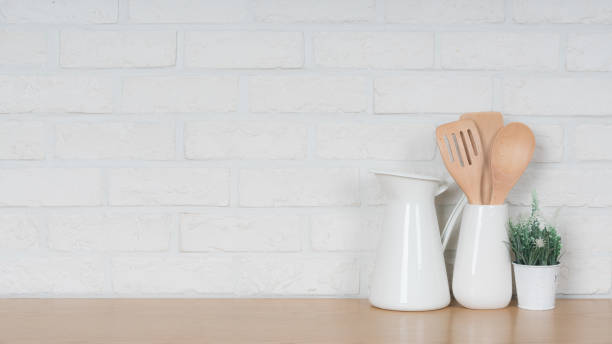 istock Kitchen utensils and dishware on wooden shelf. Kitchen interior background.Text space. 1019894812