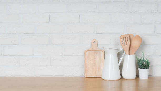 istock Kitchen utensils and dishware on wooden shelf. Kitchen interior background.Text space. 1019894818