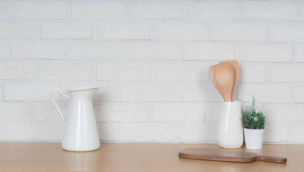 istock Kitchen utensils and dishware on wooden shelf. Kitchen interior background.Text space. 1019894820