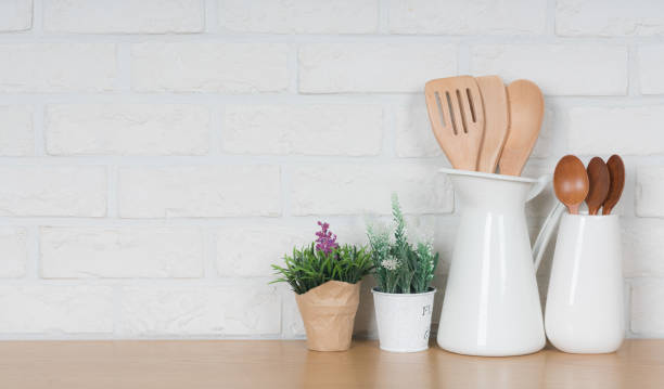 istock Kitchen utensils and dishware on wooden shelf. Kitchen interior background.Text space. 1019894936