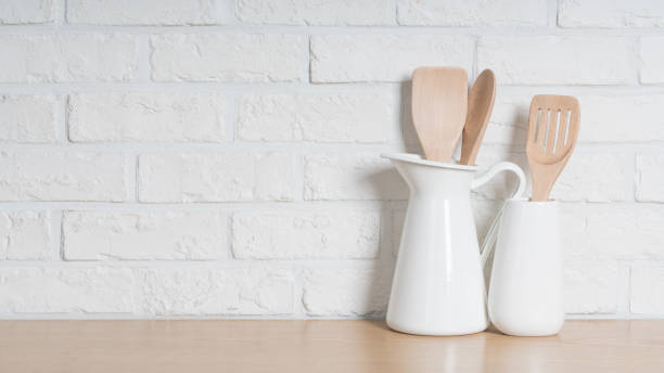 istock Kitchen utensils and dishware on wooden shelf. Kitchen interior background.Text space. 1019894998