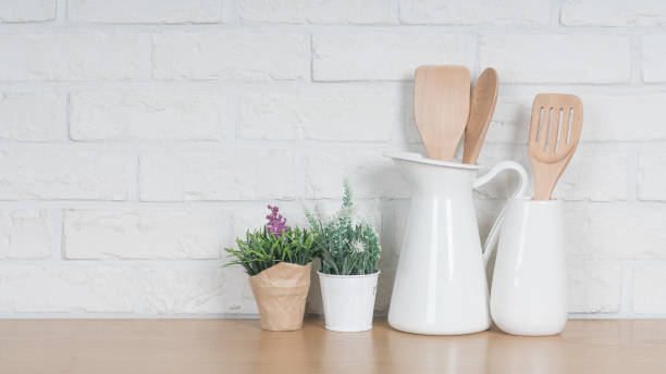 istock Kitchen utensils and dishware on wooden shelf. Kitchen interior background.Text space. 1019895020