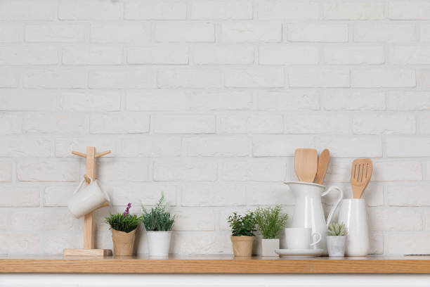 istock Kitchen utensils and dishware on wooden shelf. Kitchen interior background.Text space. 1019895236