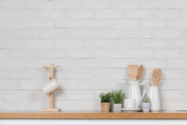 istock Kitchen utensils and dishware on wooden shelf. Kitchen interior background.Text space. 1019895238
