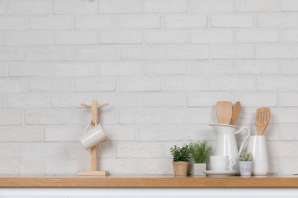 istock Kitchen utensils and dishware on wooden shelf. Kitchen interior background.Text space. 1019895246