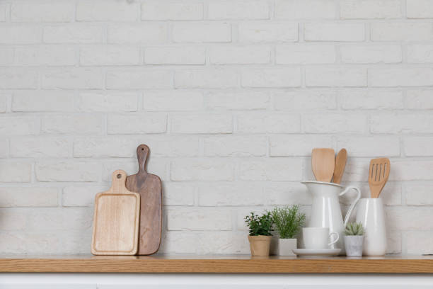 istock Kitchen utensils and dishware on wooden shelf. Kitchen interior background.Text space. 1019895252