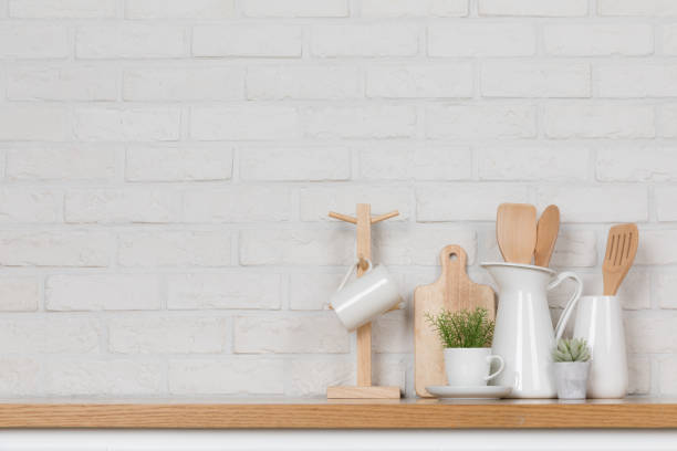 istock Kitchen utensils and dishware on wooden shelf. Kitchen interior background.Text space. 1019895254