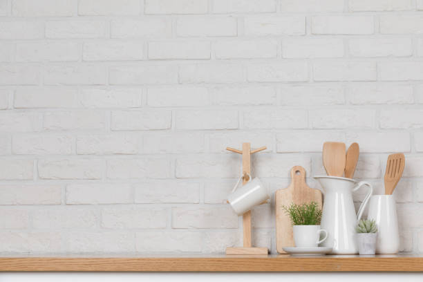 istock Kitchen utensils and dishware on wooden shelf. Kitchen interior background.Text space. 1019895268