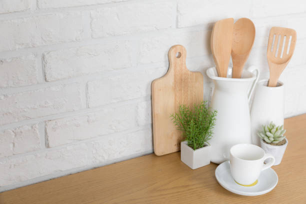 istock Kitchen utensils and dishware on wooden shelf. Kitchen interior background.Text space. 1019895286