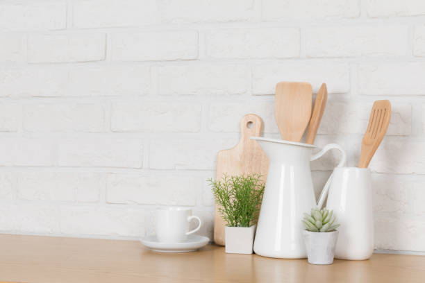 istock Kitchen utensils and dishware on wooden shelf. Kitchen interior background.Text space. 1019895312
