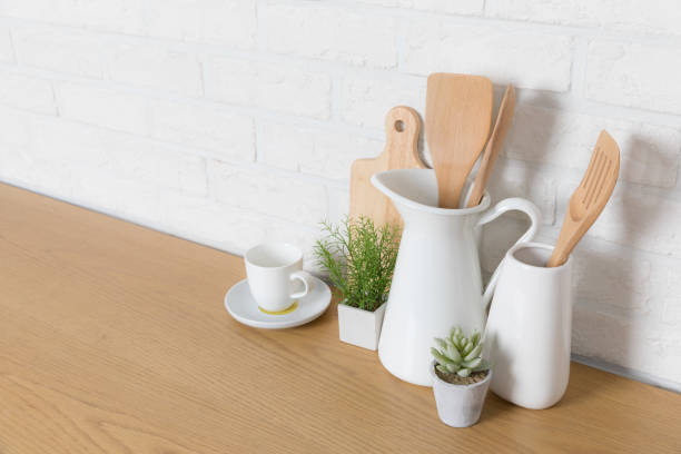 istock Kitchen utensils and dishware on wooden shelf. Kitchen interior background.Text space. 1019895316